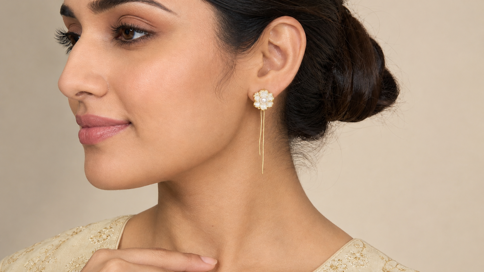 Thread drop Pearl Luna in White earrings by Buddhu, worn by a model